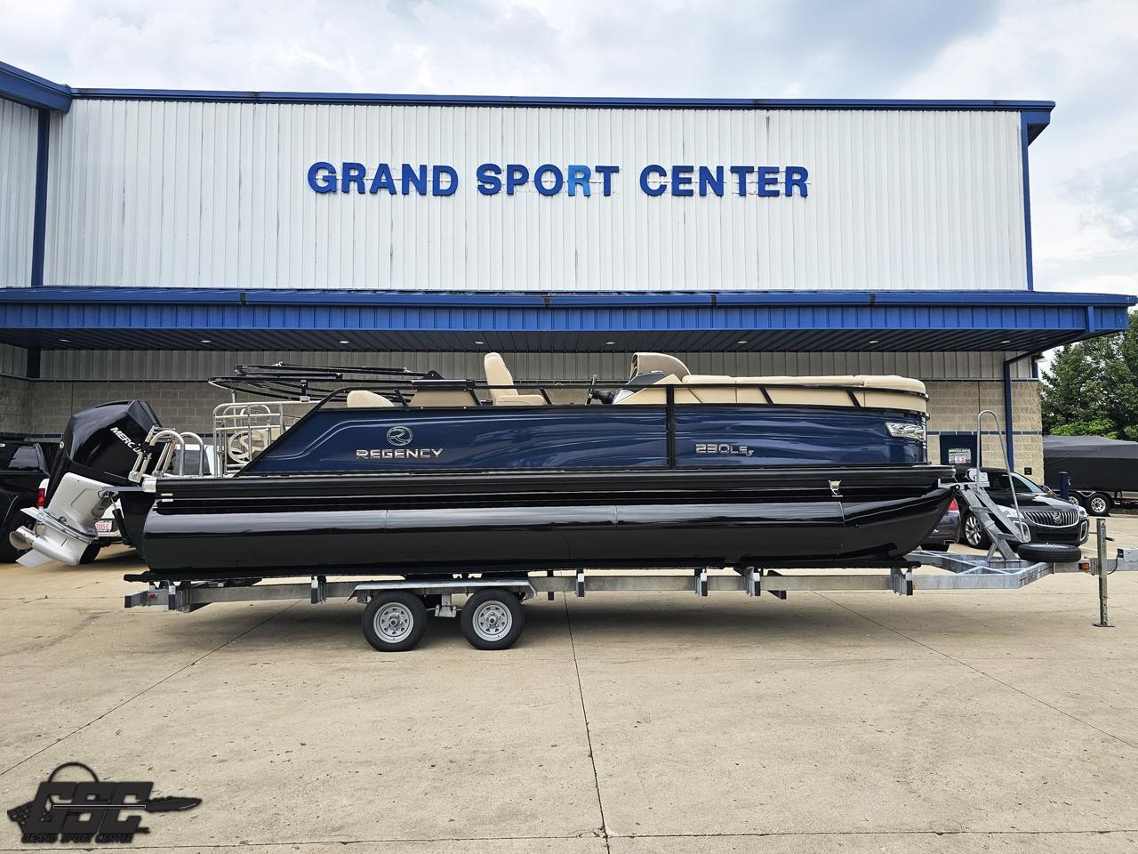 Regency 230 LE3 2022 Regency 230 LE3 pontoon boat on trailer at Grand Sport Center.