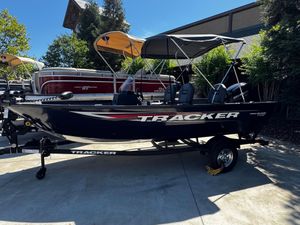 Tracker Pro Guide V-16 SC 2025 Tracker Pro Guide V-16 SC boat on trailer, parked outdoors.