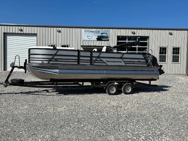 Berkshire CTS 2024 Berkshire CTS pontoon boat on trailer outside a metal building.