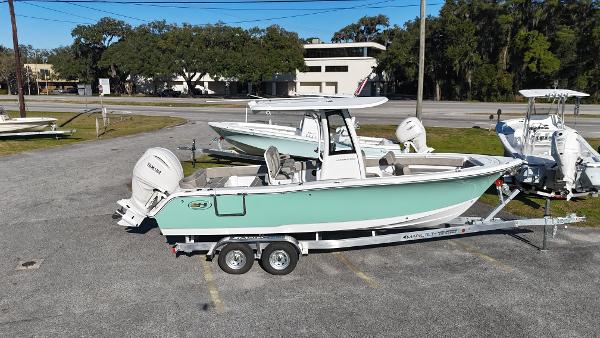 Sea Hunt 245SE Ultra 2025 Sea Hunt 245SE Ultra boat on trailer, parked outdoors.