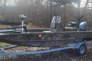 G3 Gator Tough 17 CC 2020 G3 Gator Tough 17 CC boat on trailer in wooded area.