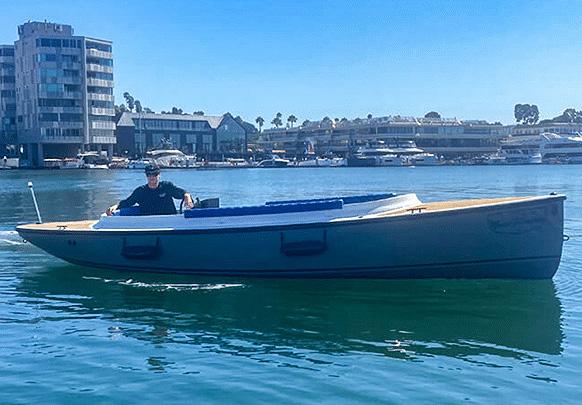 Vision Marine Technologies Fantail 217 2023 Vision Marine Technologies Fantail 217 boat on calm water, urban backdrop.