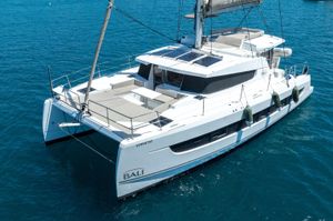 Bali 4.2 2022 Bali 4.2 catamaran sailing on clear blue water, showcasing modern design and spacious deck.