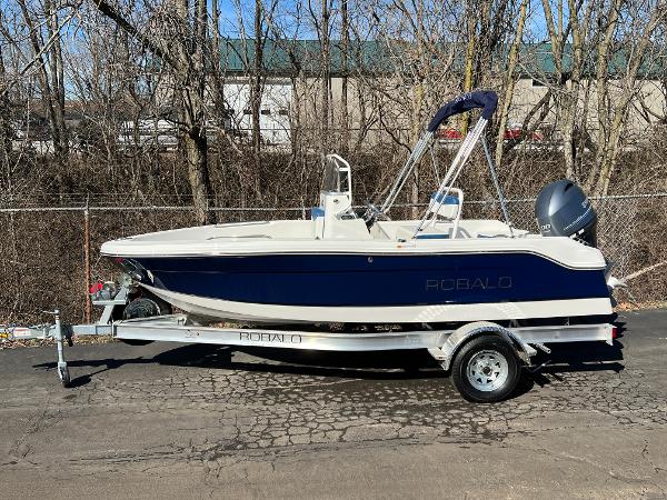 Robalo R160 Center Console 2025 Robalo R160 Center Console boat on trailer, parked outdoors.