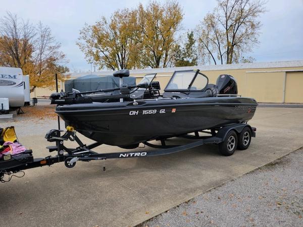 Nitro ZV19 Pro 2023 Nitro ZV19 Pro boat on trailer, parked outdoors in autumn setting.