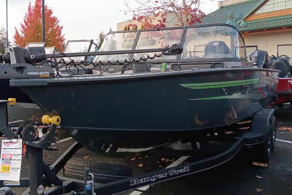 Ranger VX1988 WT 2024 Ranger VX1988 WT fishing boat on trailer, displayed outdoors with autumn foliage.