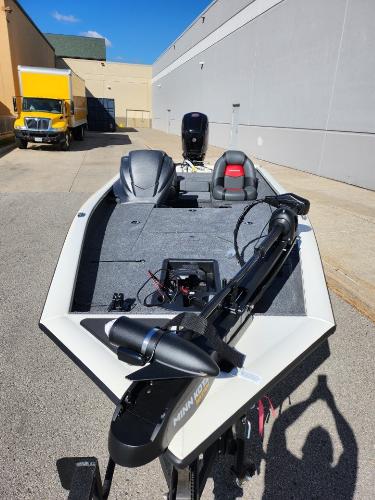 Tracker Pro Team 190 2025 Tracker Pro Team 190 boat with Minn Kota trolling motor in urban setting.