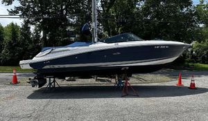 Sea Ray 270 SLX 2013 Sea Ray 270 SLX boat on stands, outdoors with traffic cones.