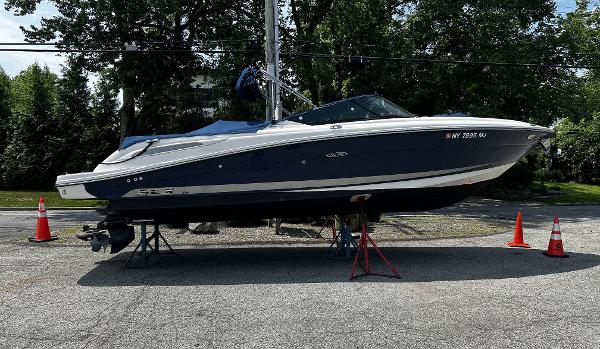 Sea Ray 270 SLX 2013 Sea Ray 270 SLX boat on stands, outdoors with traffic cones.