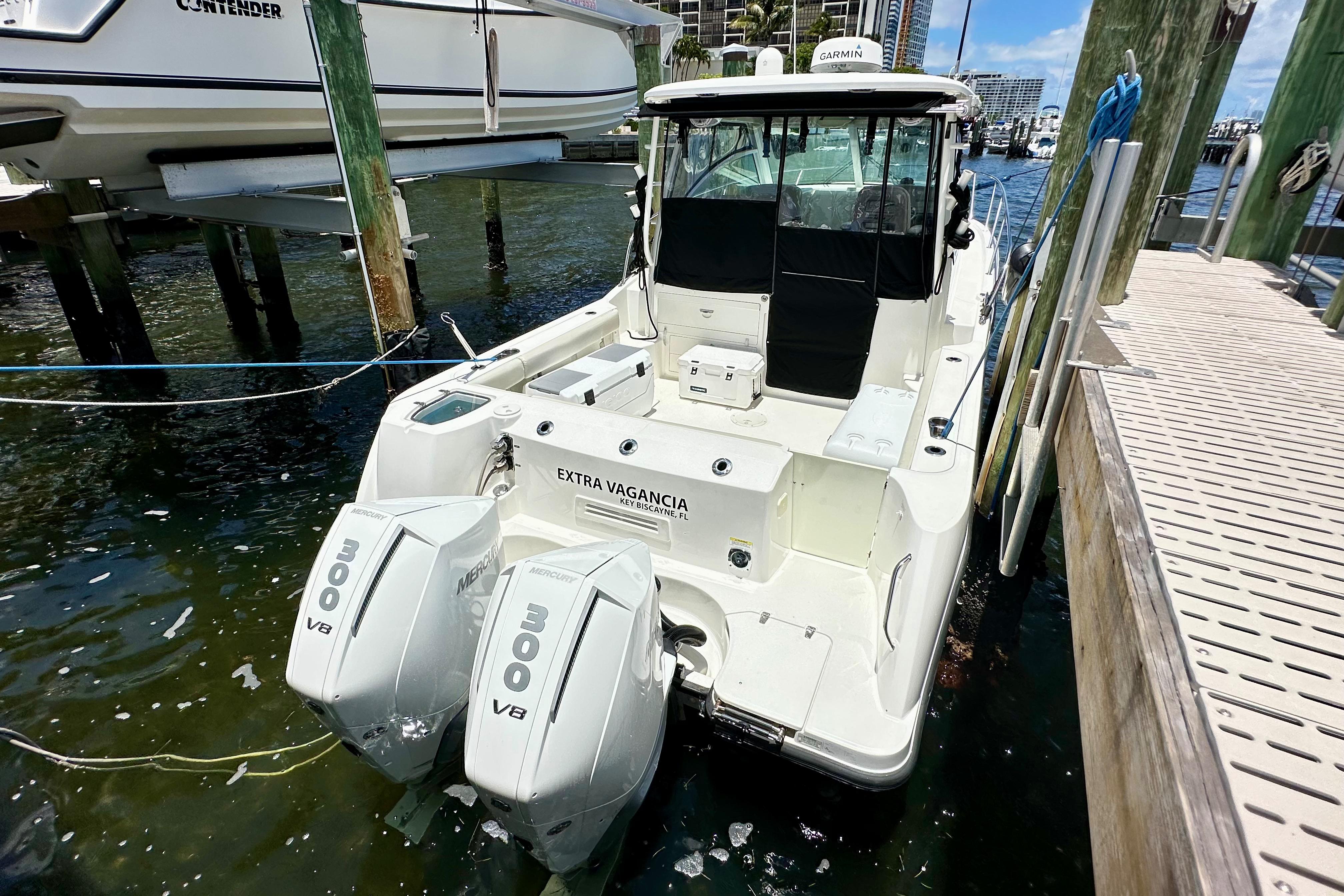 Boston Whaler 315 Conquest 2015 Boston Whaler 315 Conquest docked, featuring twin Mercury 300 V8 engines.