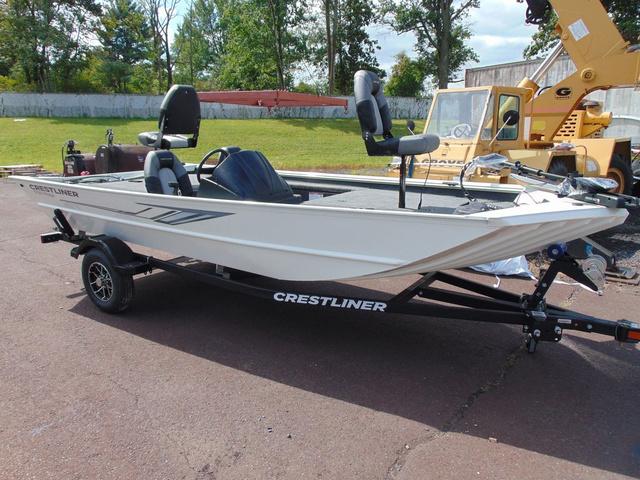 Crestliner 1700 Ridge 2025 Crestliner 1700 Ridge boat on trailer, parked outdoors, showcasing sleek design and seating.