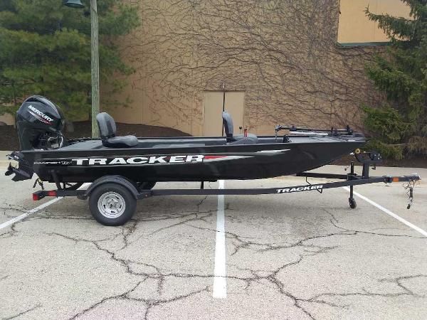 Tracker Panfish 17 2025 Tracker Panfish 17 boat on trailer, parked in a lot.