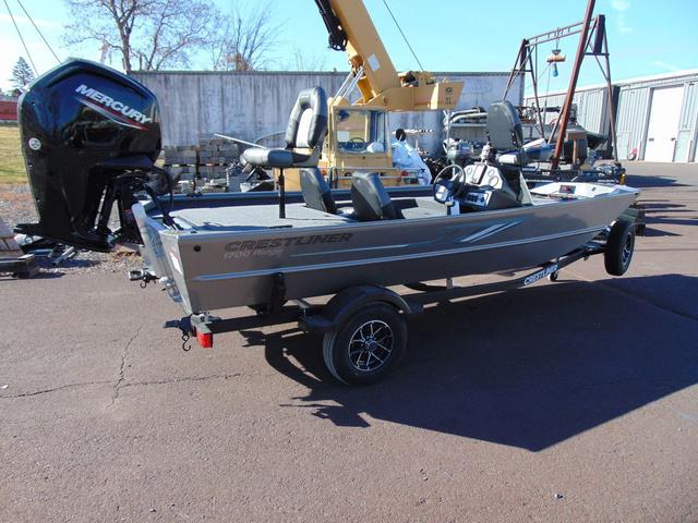 Crestliner 1700 Ridge 2025 Crestliner 1700 Ridge boat with Mercury engine on trailer, parked outdoors.