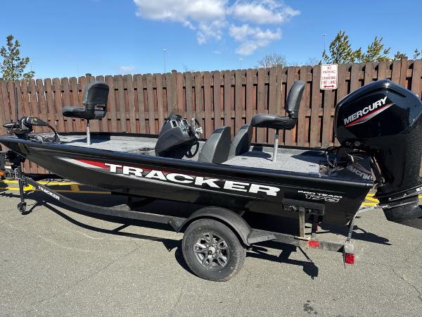 Tracker Pro Team 175 2025 Tracker Pro Team 175 boat with Mercury engine, parked outdoors.