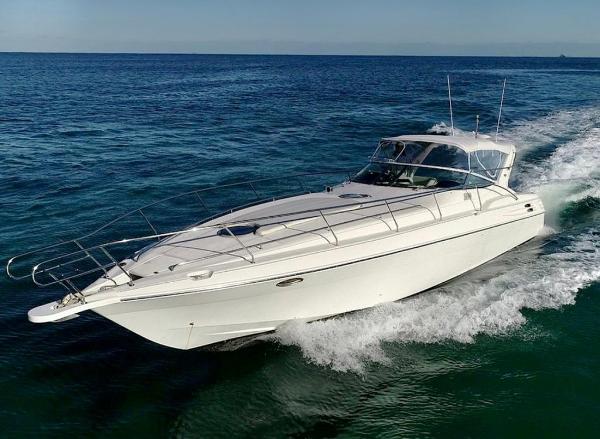 Wellcraft Excalibur 45 1995 Wellcraft Excalibur 45 cruising on open water, showcasing sleek design and performance.