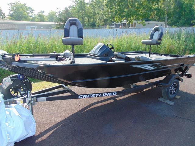 Crestliner 1700 Ridge 2025 Crestliner 1700 Ridge boat on trailer, parked outdoors with lush greenery background.