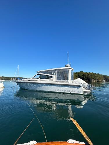 Nimbus W9 Nimbus W9 2021 boat on calm water under clear blue sky.