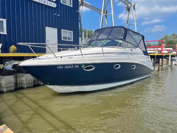 Rinker 260 Express Cruiser 2008 Rinker 260 Express Cruiser docked at marina, blue and white exterior.