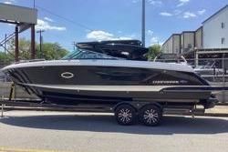 Chaparral 297 SSX 2020 Chaparral 297 SSX boat on trailer, sleek design, parked outdoors.
