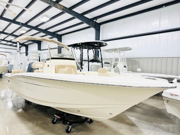 Scout 195 Sportfish 2025 Scout 195 Sportfish boat displayed in a showroom.