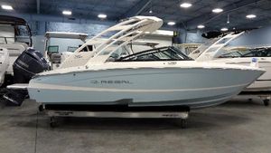 Regal LX2 2025 Regal LX2 boat in showroom, light blue hull, sleek design.