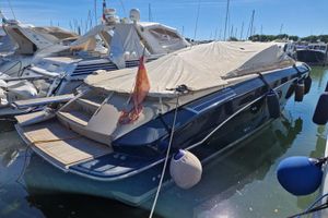 Cantieri di Sarnico spider 43 2009 Cantieri di Sarnico Spider 43 yacht docked with cover, surrounded by other boats.