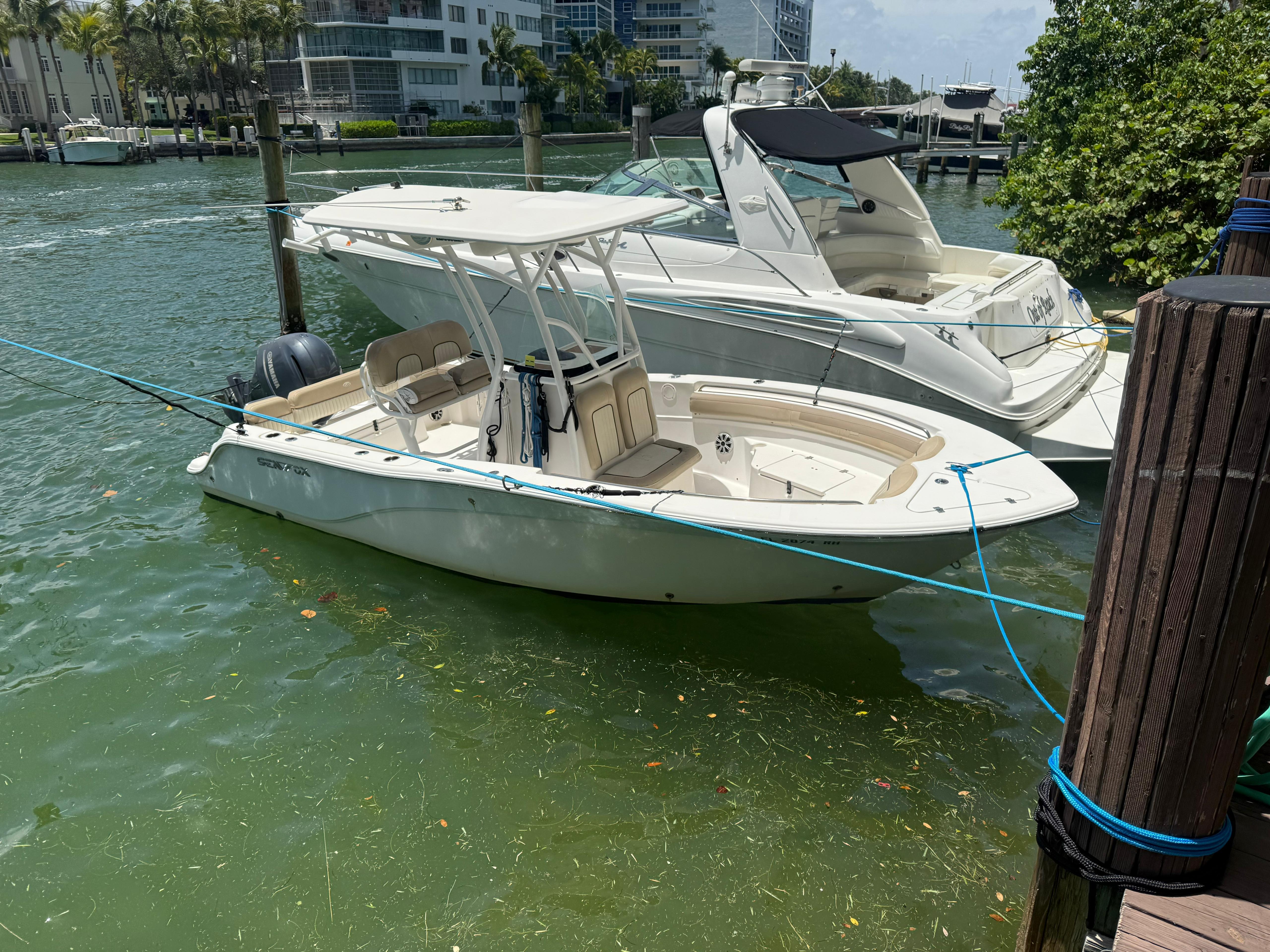 Sea Fox 226 Commander 2017 Sea Fox 226 Commander boat docked in a marina, surrounded by water and other boats.