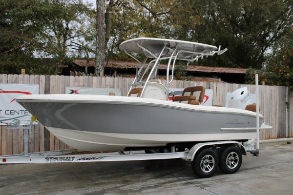 Pioneer 202 Sportfish 2025 Pioneer 202 Sportfish boat on trailer, gray and white design, parked outdoors.