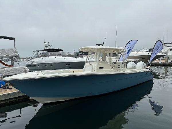 Cobia 320 Center Console 2024 Cobia 320 Center Console boat docked in marina.