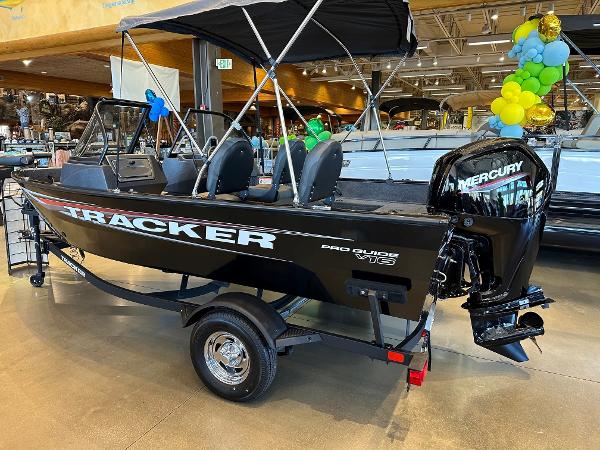 Tracker Pro Guide V-16 WT 2025 Tracker Pro Guide V-16 WT boat displayed indoors with Mercury engine.