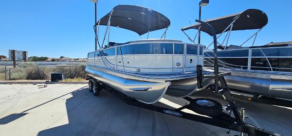 South Bay 224FCRLE 2025 South Bay 224FCRLE pontoon boat on a trailer, parked outdoors.