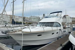 Beneteau Antares 12 2007 Beneteau Antares 12 yacht docked in a marina with cityscape background.