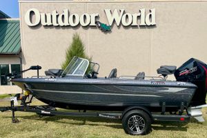 Triton 186 Allure 2024 Triton 186 Allure boat displayed outside Outdoor World store.