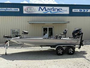Xpress H20C Crappie 2026 Xpress H20C Crappie boat on trailer outside L&M Marine LLC building.