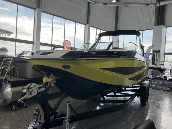 Scarab 255 2024 Scarab 255 boat on display in a showroom.