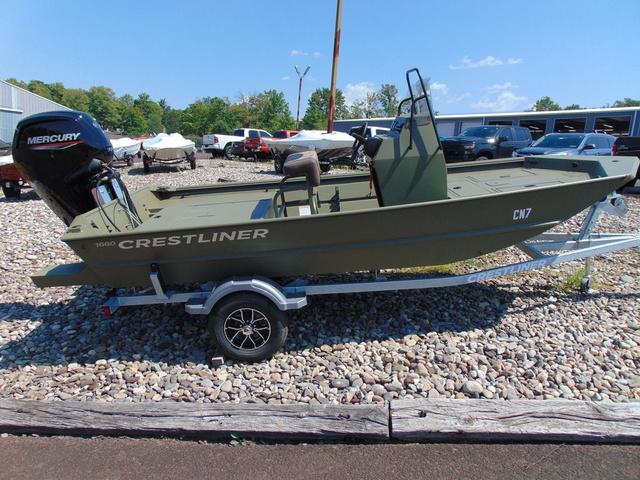 Crestliner 1660 Forward Center Console 2025 Crestliner 1660 Forward Center Console boat on trailer, outdoors, with Mercury engine.