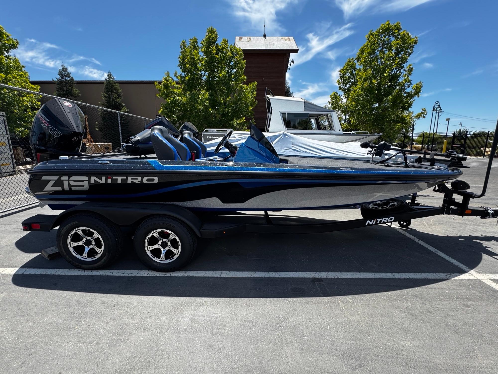 Nitro Z19 Pro 2025 Nitro Z19 Pro boat on trailer, parked outdoors under clear sky.