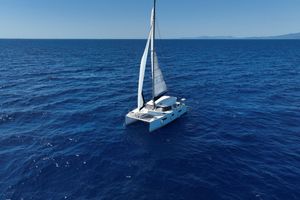 Nautitech 40 Open 2016 Nautitech 40 Open catamaran sailing on open blue sea under clear sky.