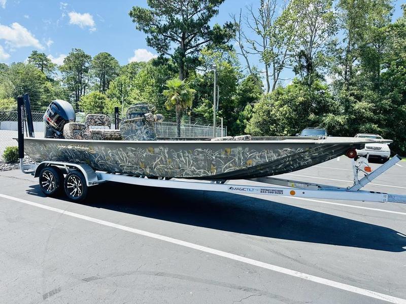 War Eagle Blackhawk 2170 2026 War Eagle Blackhawk 2170 boat on trailer, parked outdoors, surrounded by trees.