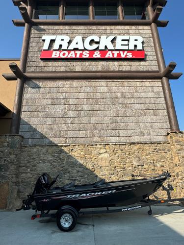 Tracker Super Guide V-16 T 2025 Tracker Super Guide V-16 T boat displayed outside Tracker Boats & ATVs store.