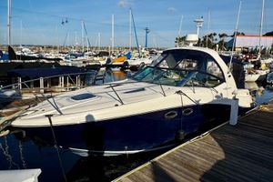 Sea Ray 290 Sundancer 2007 Sea Ray 290 Sundancer docked at a marina under clear blue skies.