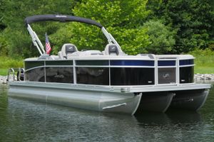 Barletta ARIA 22QC 2025 Barletta ARIA 22QC pontoon boat on a serene lake with lush greenery.