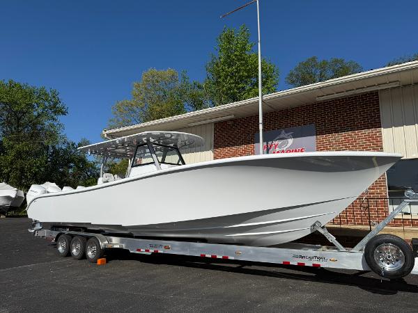 Yellowfin 39 Offshore 2025 Yellowfin 39 Offshore boat on a trailer, parked outside a brick building.