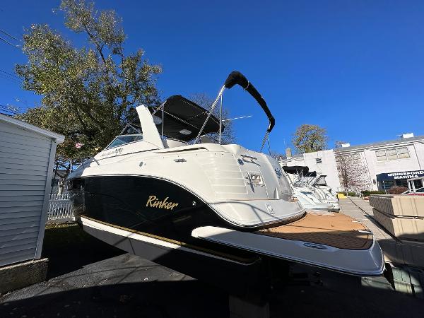 Rinker Fiesta Vee 300 2005 Rinker Fiesta Vee 300 boat displayed outdoors under clear blue sky.