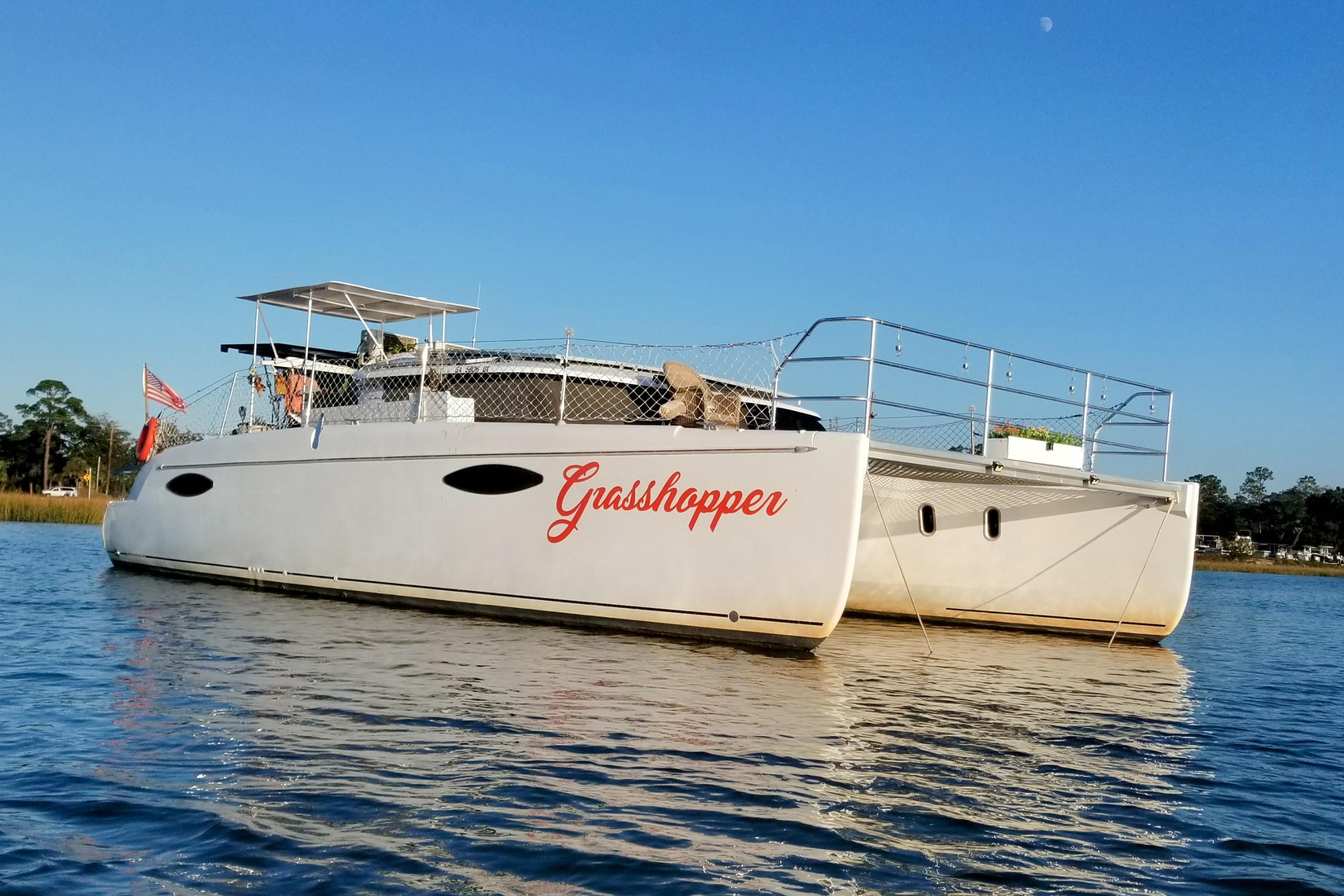 Fountaine Pajot Orana 44 Grand Large 2011 Fountaine Pajot Orana 44 Grand Large catamaran named "Grasshopper" on calm water.
