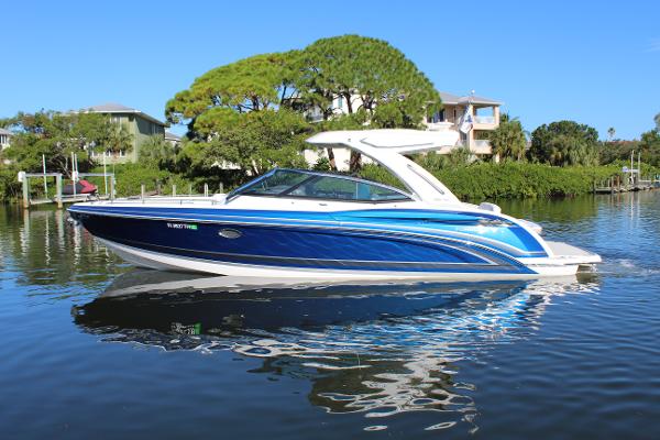 Formula 330 Crossover Bowrider 2023 Formula 330 Crossover Bowrider in a scenic waterway setting.