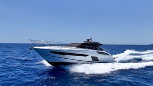 Princess V58 Deck 2016 Princess V58 Deck yacht cruising on open blue sea.