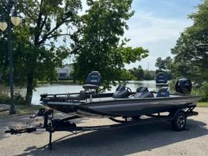 Ranger RT198P 2025 Ranger RT198P boat on trailer by a scenic lake.