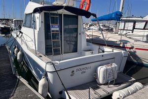 Beneteau Antares 9 Fly 2006 Beneteau Antares 9 Fly boat docked, for sale sign visible, marina background.