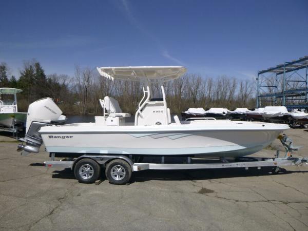 Ranger 2360 Bay 2024 Ranger 2360 Bay boat on trailer, parked outdoors.